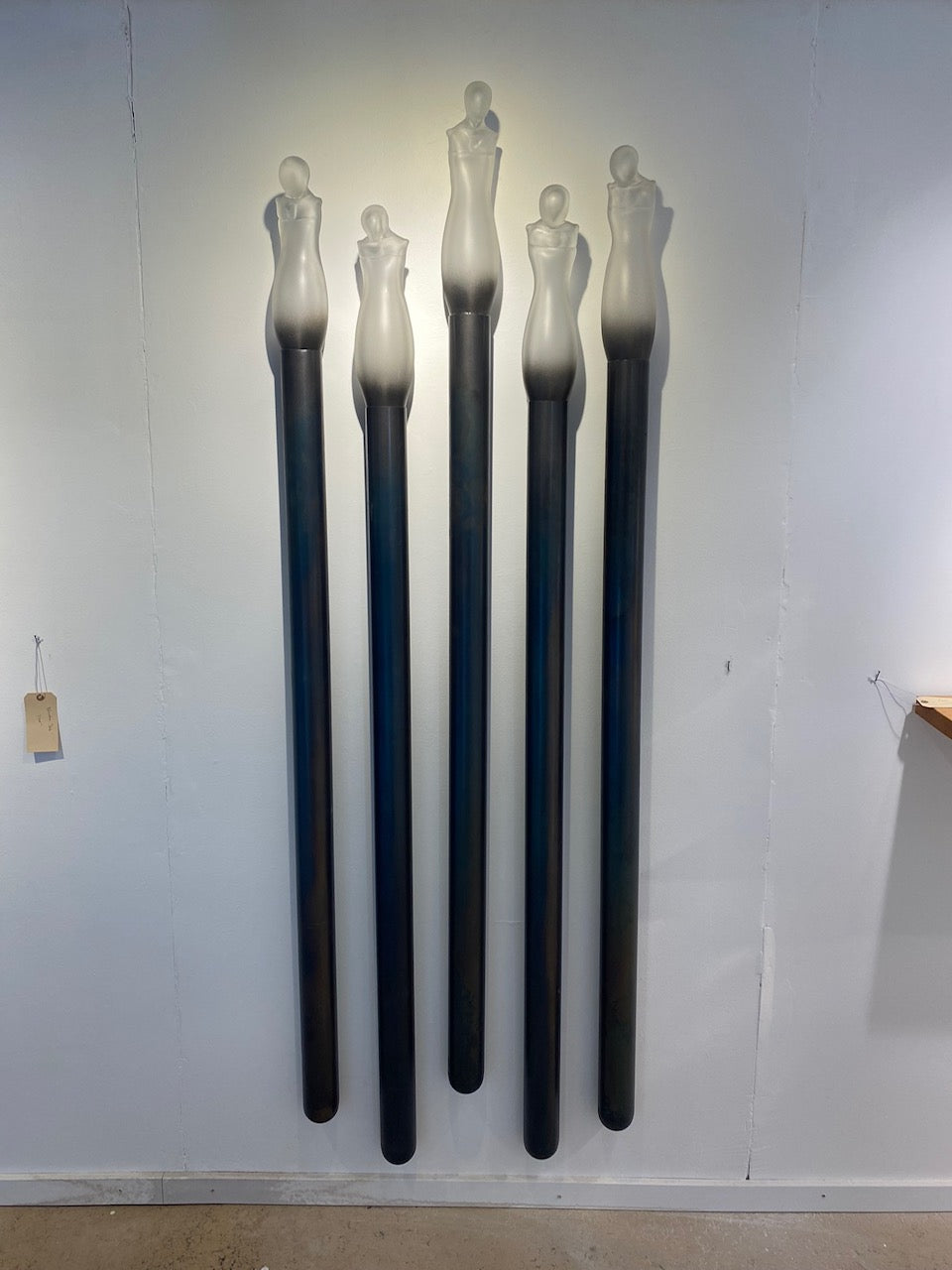 Figurative glass mounted on steel tube